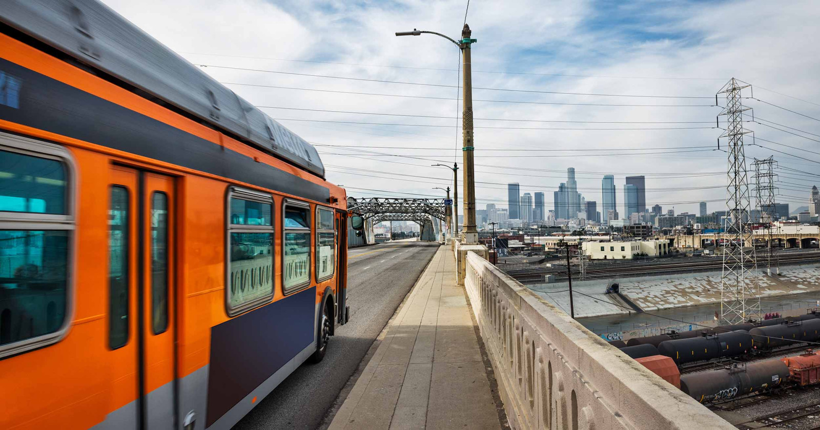 LA metro bus going over a bridge