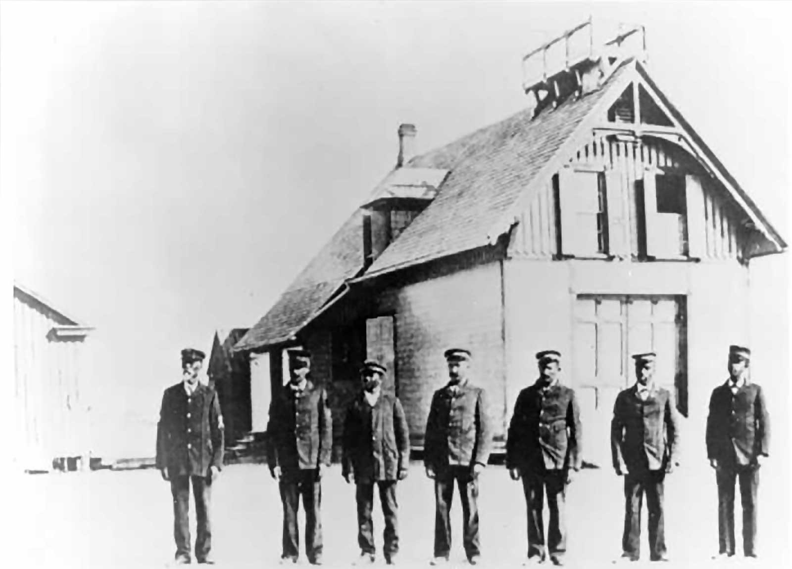 Keeper Richard Etheridge (on left) and the Pea Island Life-Saving crew in front of their station, circa 1896