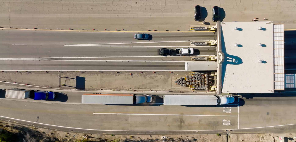 Aerial image of Trucks at checkpoint on California highway